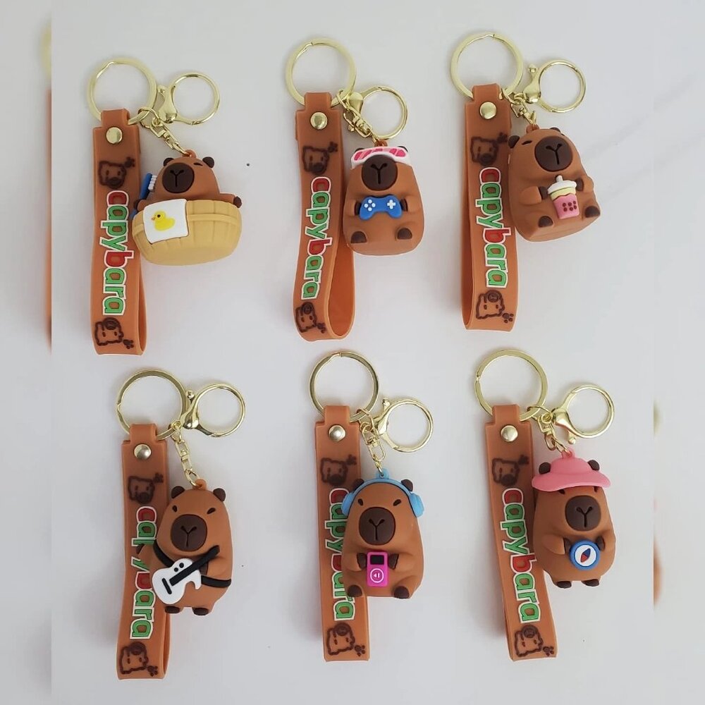 NWT CAPYBARAS KEY CHAIN DIFFERENT ACTIONS 3D LOGO